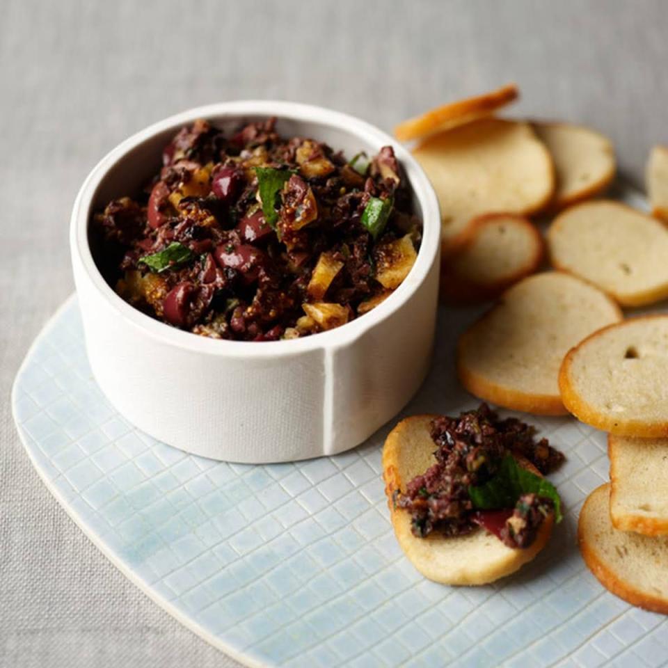 <p>Dried figs give this tapenade a sweet, tangy flavor that pairs perfectly with crunchy bagel chips.</p><p><em><a href="https://www.delish.com/cooking/recipe-ideas/recipes/a21124/black-olive-tapenade-figs-mint-recipe-fw0313/" rel="nofollow noopener" target="_blank" data-ylk="slk:Get the recipe from Delish »;elm:context_link;itc:0;sec:content-canvas" class="link ">Get the recipe from Delish »</a></em></p>