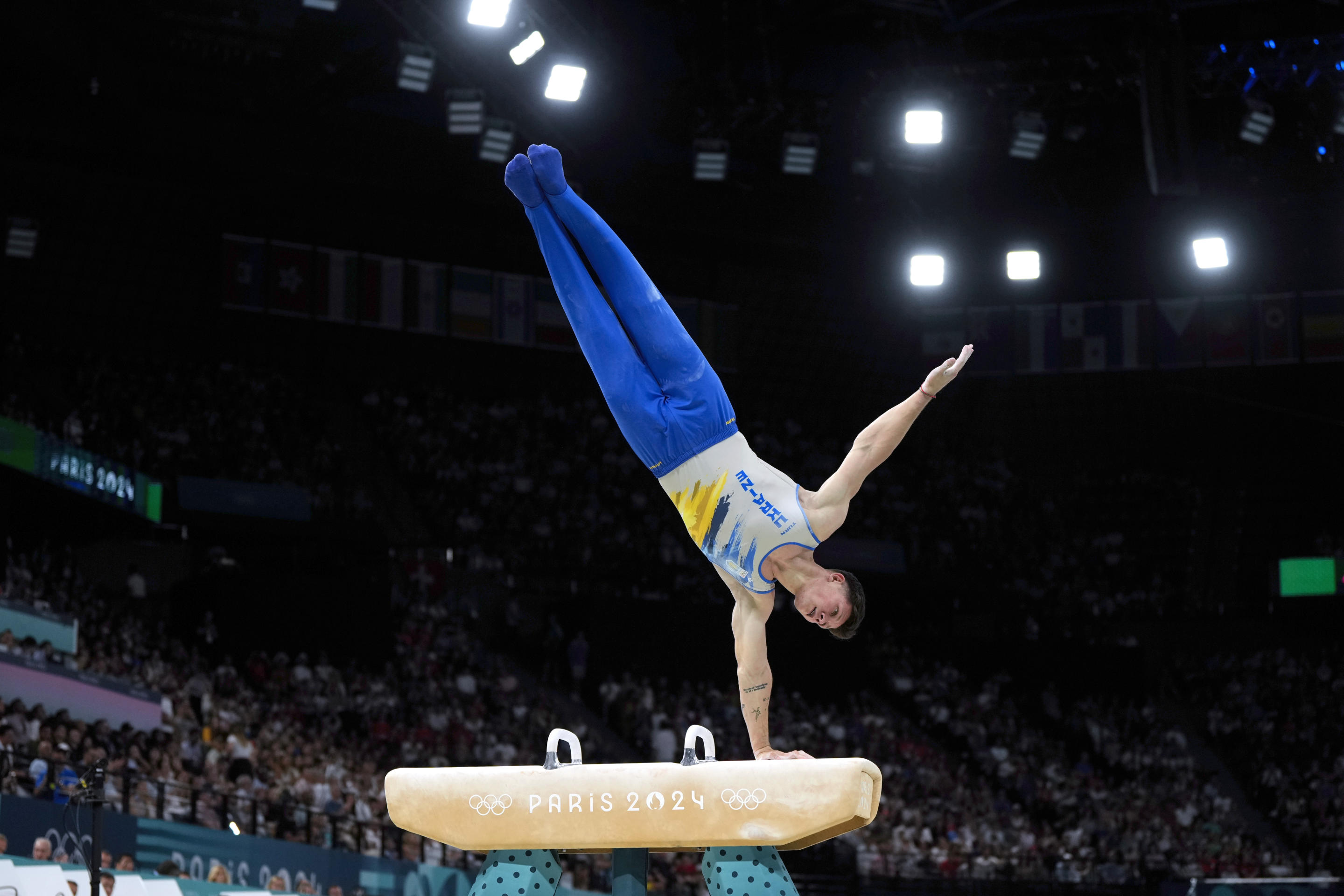 Illia Kovtun, of Ukraine, performs on the pommel horse during the men's artistic gymnastics team finals round at Bercy Arena at the 2024 Summer Olympics on July 29, 2024, in Paris, France. (Charlie Riedel/AP)