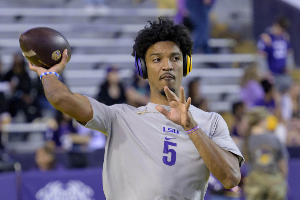 LSU quarterback Jayden Daniels warms up during an NCAA college football game against Georgia State in Baton Rouge, La., Saturday, Nov. 18, 2023. (AP Photo/Matthew Hinton)