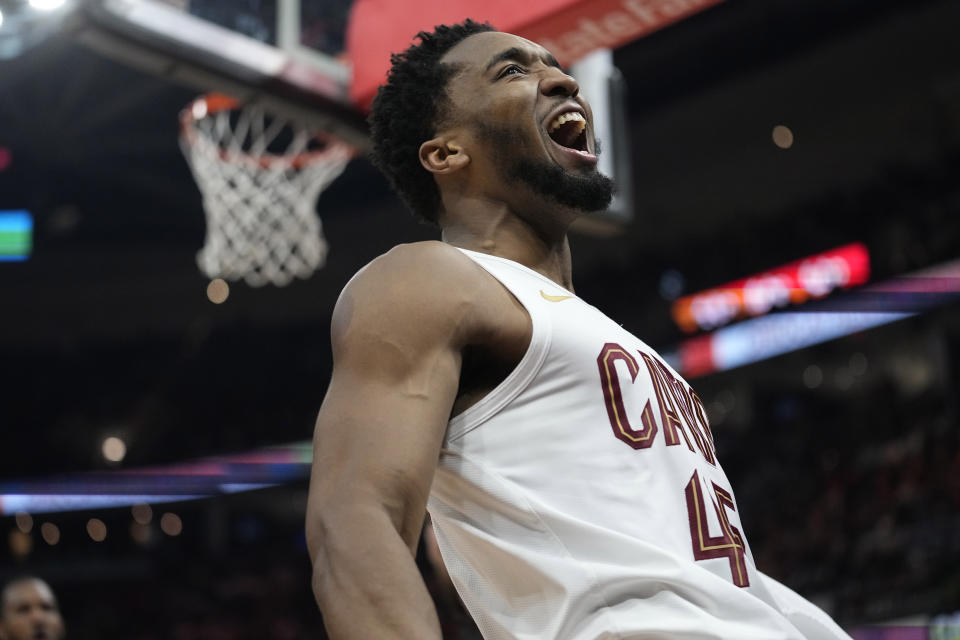 Cleveland Cavaliers guard Donovan Mitchell celebrates after a dunk in the second half of an NBA basketball game against the Sacramento Kings, Monday, Feb. 5, 2024, in Cleveland. (AP Photo/Sue Ogrocki)