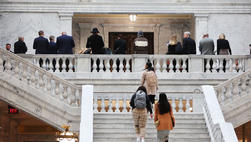 Attendees stand and walk outside the House of Representatives at the Capitol in Salt Lake City on Jan. 31, 2023. Is it time for Utah to have a full-time legislature?