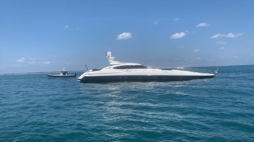 The Atlantis, pictured off the coast of Florida on Saturday, is a superyacht measuring 80-feet. Yachts of that size are typically worth upwards of $1m. (U.S. Coast Guard District 7 PADE)