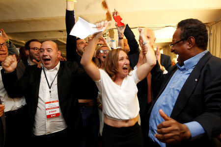 Supporters of French President-elect Emmanuel Macron, head of the political movement En Marche !, or Onwards !, react after announcement in the second round of 2017 French presidential election at En Marche local headquarters in Marseille, France, May 7, 2017. REUTERS/Philippe Laurenson