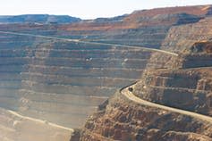 <span class="caption">Super Pit goldmine in Kalgoorlie, Western Australia.</span> <span class="attribution"><a class="link " href="https://www.shutterstock.com/image-photo/panoramic-aerial-view-super-pit-goldmine-655692787" rel="nofollow noopener" target="_blank" data-ylk="slk:Shutterstock/RobBayer;elm:context_link;itc:0;sec:content-canvas">Shutterstock/RobBayer</a></span>