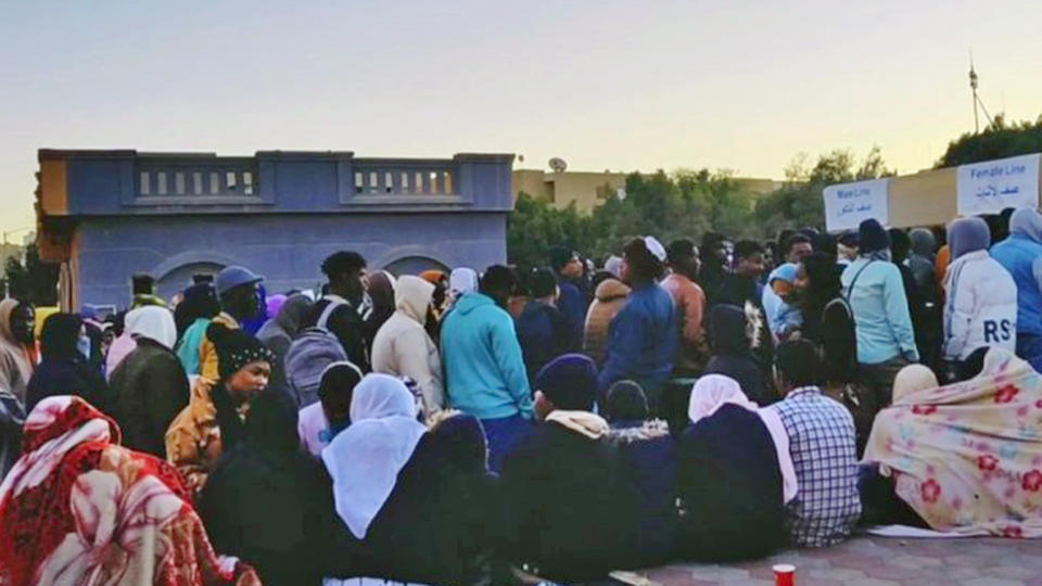 Sudanese migrants queuing in Cairo, Egypt