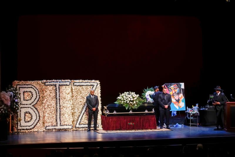 People stand guard next to the casket for late rapper Marcel Theo Hall, known by his stage name Biz Markie, during the funeral service in Patchogue, New York