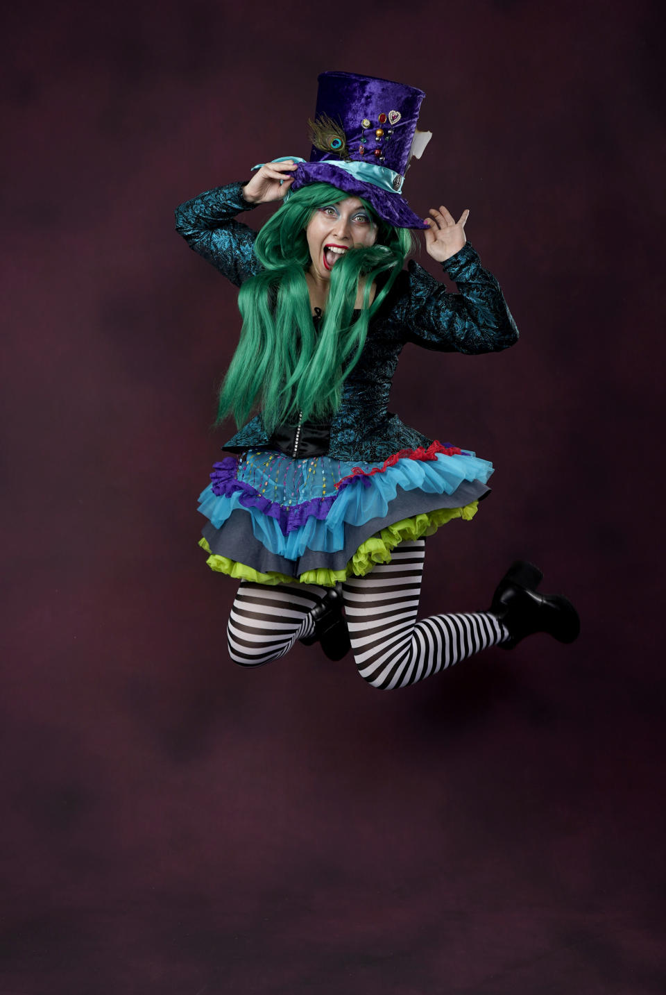 Kaleigh Kailani, from Los Angeles, poses for a portrait dressed as the Mad Hatter on day one of Comic-Con International on Thursday, July 21, 2022, in San Diego. (AP Photo/Chris Pizzello)
