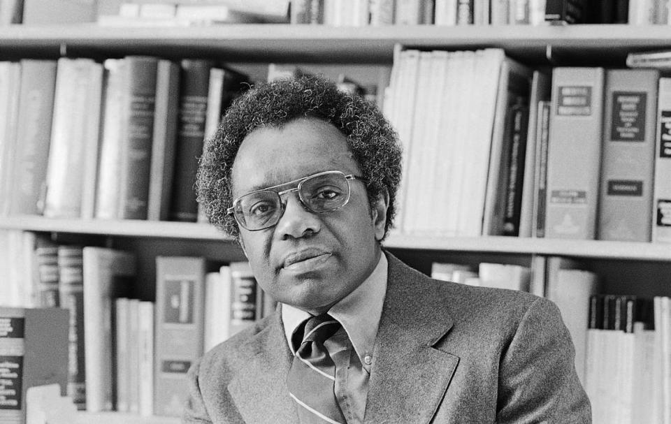 FILE - Professor Derrick Bell of the University of Washington Law School shown in his office in this Jan. 30, 1980 file photo. Derrick Bell, a civil rights scholar and writer who was the first tenured black professor at Harvard Law School, died Wednesday Oct. 5, 2011. He was 80. Bell died Wednesday night of carcinoid cancer at a Manhattan hospital, his wife, Janet Dewart Bell, said Friday. (AP Photo, File)