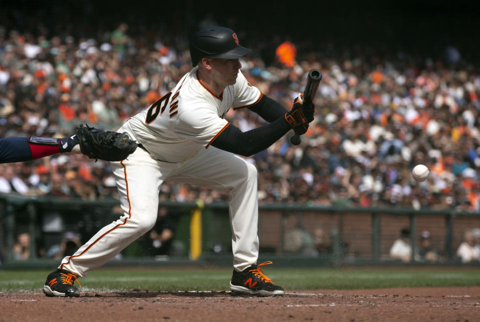 San Francisco Giants' Anthony DeSclafani lays down a sacrifice bunt against the Atlanta Braves during the third inning of a baseball game, Sunday, Sept. 19, 2021, in San Francisco. (AP Photo/D. Ross Cameron)