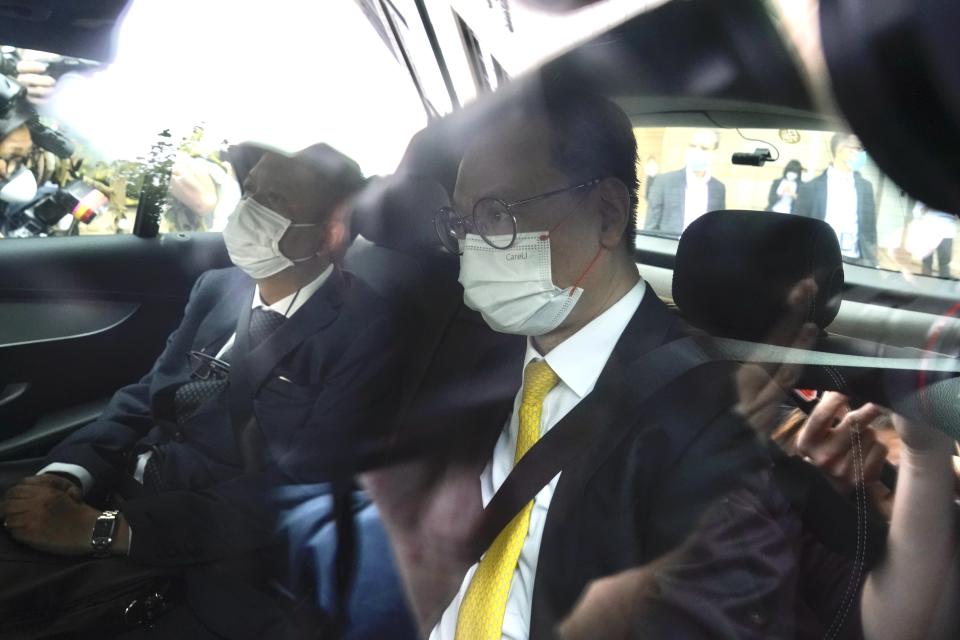 Solicitor Trevor Chan, lawyer of Hong Kong pro-democracy activist Andy Li, leaves a court in Hong Kong, Wednesday, April 7, 2021. Li is one of the 12 young pro-democracy activists captured at sea last year by mainland Chinese authorities and returned to Hong Kong in March, as Li is charged with an offense under the newly-invented National Security Law. (AP Photo/Kin Cheung)