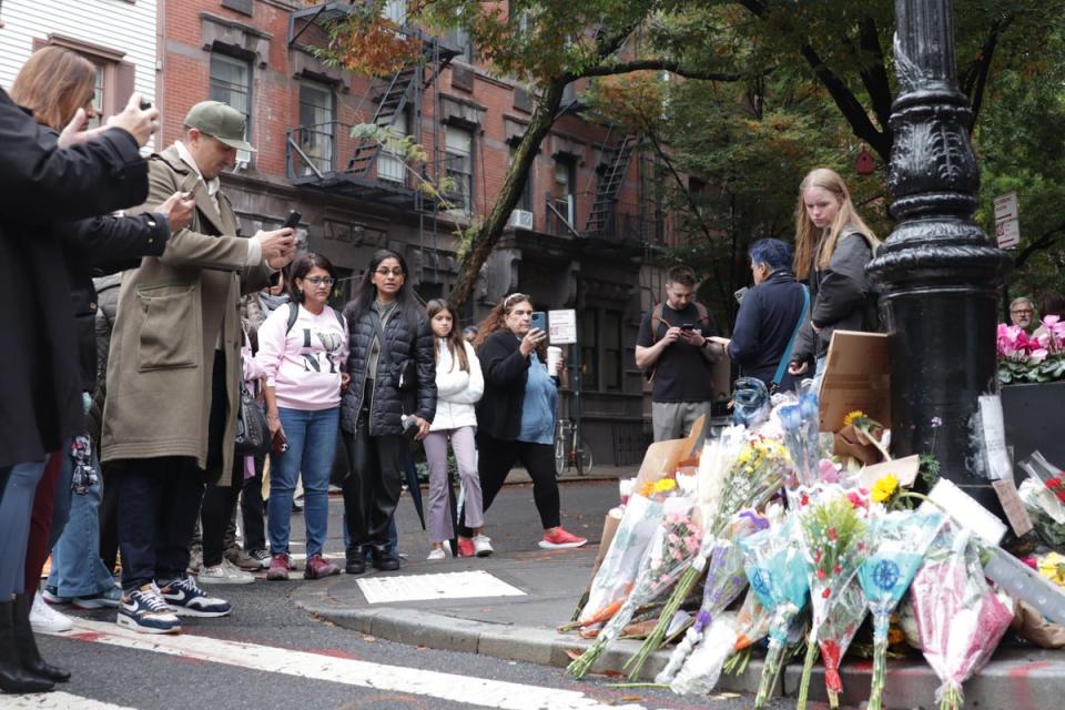 Fans gather outside the ‘Friends’ building in NYC (Inga Parkel/The Independent)