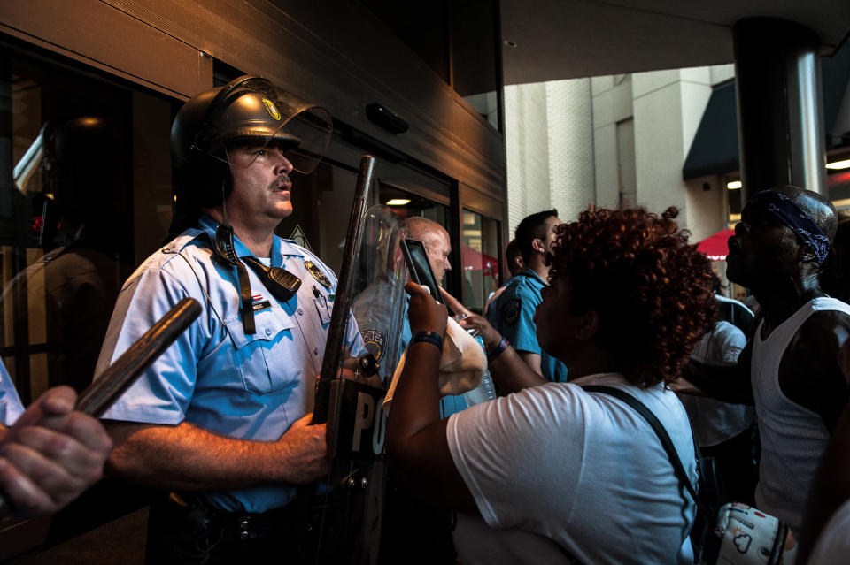 Riot police guard the entrance to the St. Louis Galleria, where protesters gathered on Wednesday. (Photo: Joseph Rushmore for HuffPost)