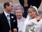 <p>The Queen looks on after the wedding of her son Prince Edward to Sophie, Countess of Wessex at St George's Chapel in Windsor on 19 June 1999. (AFP via Getty Images)</p> 