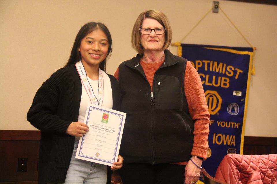 Linda Andorf poses for a photo with Jennifer Ramos, who won second place in the Perry Optimist Club essay contest.