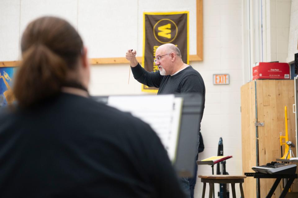 Conductor Stephen White directs the Cereal City Concert Band during a rehearsal at Battle Creek Central High School on Monday, March 11, 2024.