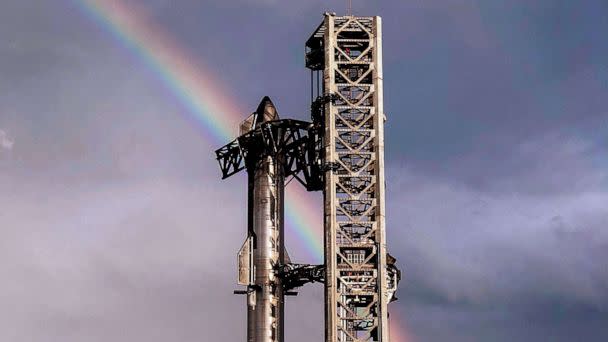 PHOTO: FILE - This handout image provided by SpaceX shows a rainbow in the sky behind the 164-foot (50-meter) tall Starship spacecraft sitting atop the 230-foot tall Super Heavy rocket from Starbase in Boca Chica, Texas, April 10, 2023. (SPACEX/AFP via Getty Images, FILE)