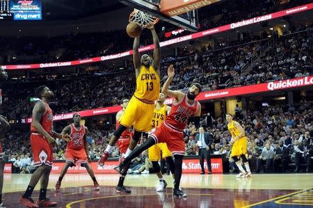 May 6, 2015; Cleveland, OH, USA; Cleveland Cavaliers center Tristan Thompson (13) slam dunks over Chicago Bulls forward Nikola Mirotic (44) during the fourth quarter in game two of the second round of the NBA Playoffs at Quicken Loans Arena. The Cavs won 106-91. Mandatory Credit: Ken Blaze-USA TODAY Sports