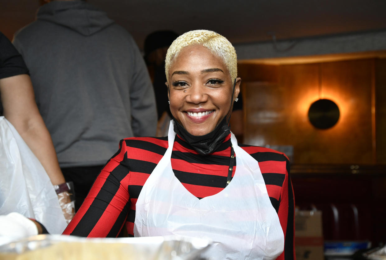 Comedian Tiffany Haddish serves food at the Laugh Factory’s 41st free Thanksgiving dinner at The Laugh Factory on Nov.25, 2021, in West Hollywood, Calif. - Credit: Michael Tullberg/Getty Images
