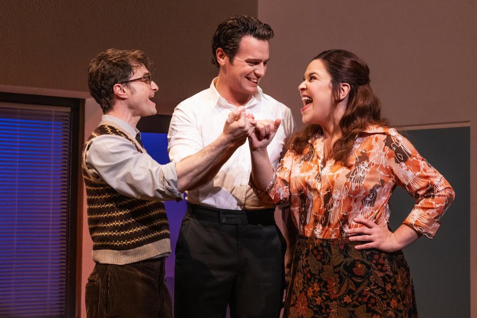 Daniel Radcliffe, left, Jonathan Groff and Lindsay Mendez in "Merrily We Roll Along."