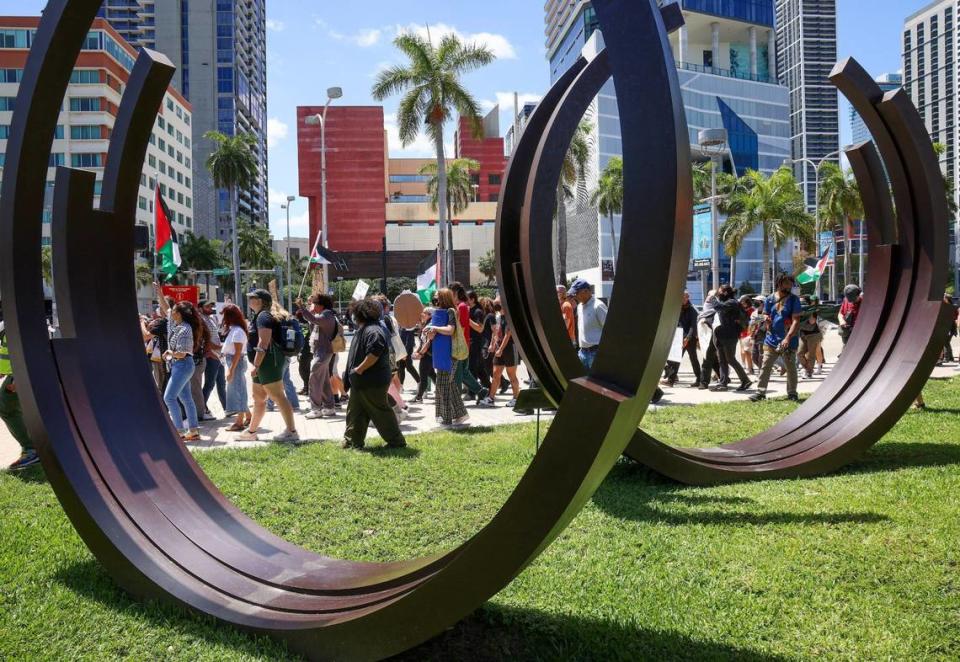 A group protesting for ceasefire in support of Gaza marched towards Bayside, passing in front of the Bernar Venet’s ‘Arcs in Disorder: 3 Arcs x 5’ on Monday, April 15, 2024. Seven protesters were arrested on charges of blocking the intersection of 3rd Street and northbound Biscayne.. Carl Juste/cjuste@miamiherald.com