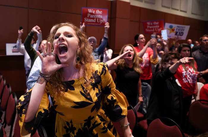 Angry parents and community members protest after a Loudoun County School Board meeting was halted by the school board because the crowd refused to quiet down.