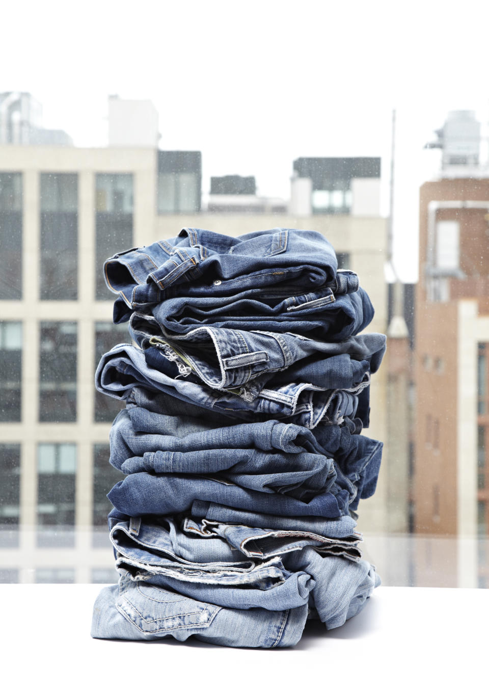 Stack of denim jeans 