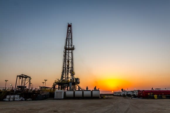 An oil rig at sunset.