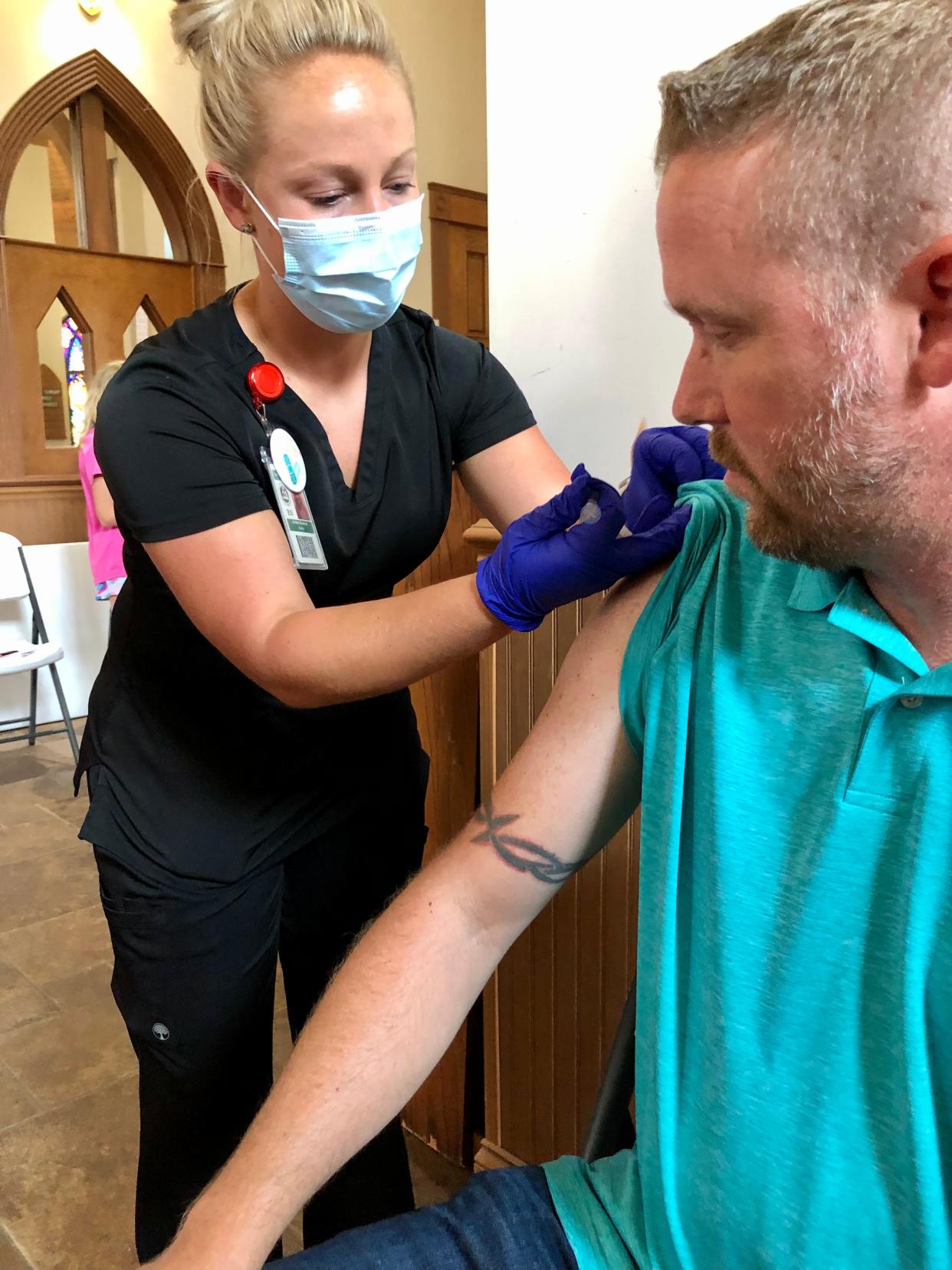 Josh Shelton prepares to get his COVID-19 vaccine at Shelby's Episcopal Church of the Redeemer in this Star file photo.