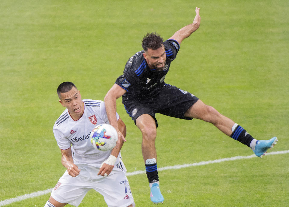 CF Montreal's Rudy Camacho, right, challenges Real Salt Lake's Bobby Wood during the second half of an MLS soccer game in Montreal, Sunday, May 22, 2022. (Graham Hughes/The Canadian Press via AP)