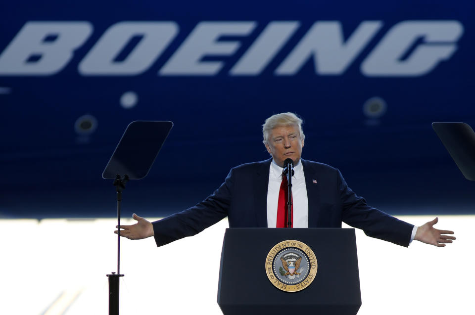 FILE- In this Feb. 17, 2017, file photo, President Donald Trump to speaks to Boeing employees in the final assembly building at Boeing South Carolina in North Charleston, S.C. The Air Force, which has been looking for ways to lower the cost of new planes for Air Force One, confirmed on Tuesday, Aug. 1, that it is talking to Boeing about buying two jumbo jets that were ordered but never delivered to a now-defunct Russian airline. (AP Photo/Mic Smith, File)