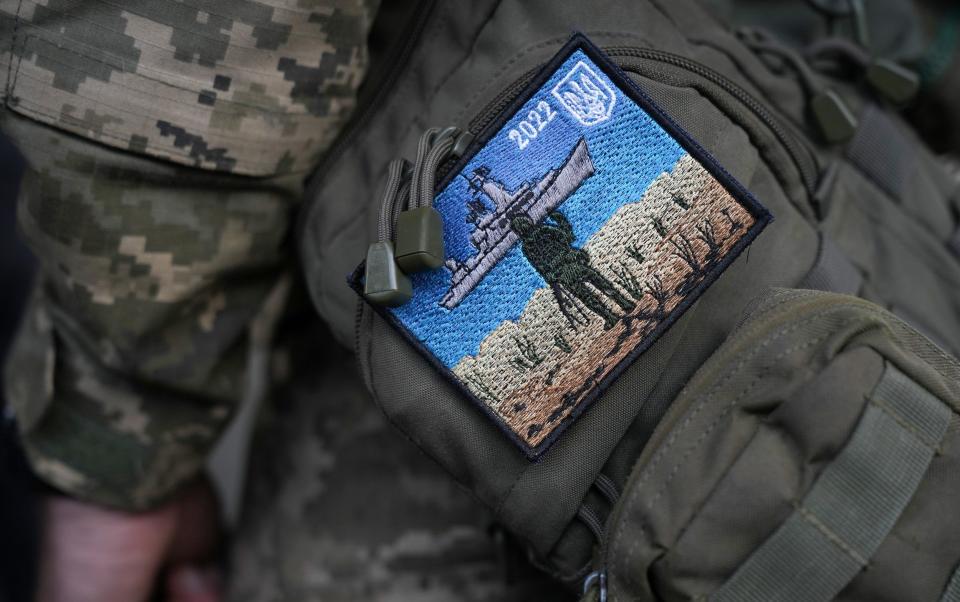 A Ukrainian soldier wears a 'Snake Island' embroidered badge on his uniform - Christopher Furlong 