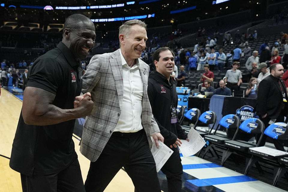 Alabama head coach Nate Oats, center, walks off the court after a win over North Carolina in a Sweet 16 college basketball game in the NCAA tournament Thursday, March 28, 2024, in Los Angeles. (AP Photo/Ashley Landis)