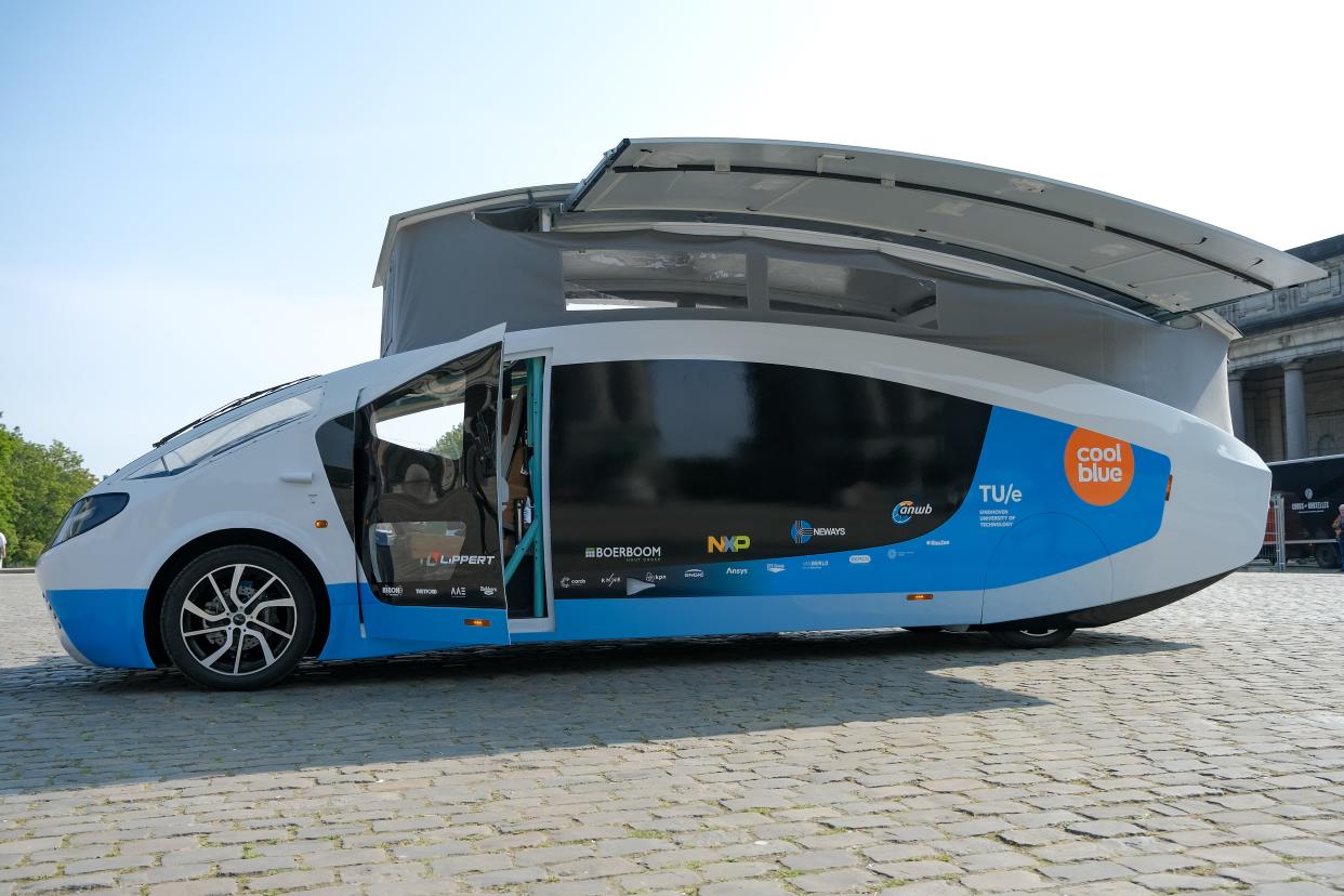 Photo taken on Sept. 20, 2021 shows Stella Vita, a solar-powered recreational vehicle, in Brussels, Belgium.  Designed by the solar team of Eindhoven University of Technology, Stella Vita is equipped with solar panels on the roof, through which the vehicle generates enough energy to drive, shower, watch TV, charge, etc. By using energy efficiently, Stella Vita can travel up to 730 km on a sunny day. (Photo by Zhang Cheng/Xinhua via Getty Images)