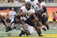 Colorado quarterback Brendon Lewis, middle, runs against California during the first half of an NCAA college football game in Berkeley, Calif., Saturday, Oct. 23, 2021. (AP Photo/Jeff Chiu)