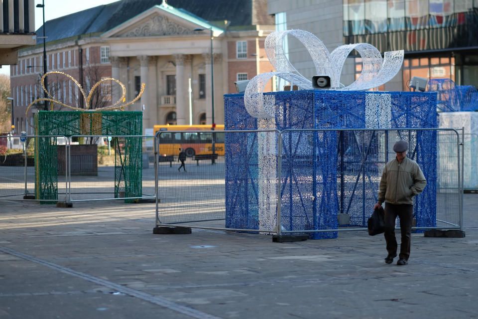 The illuminated display of four hollowed out gifts has been erected in Derby city centre in a bid to attract visitors over the festive period (Picture: SWNS)