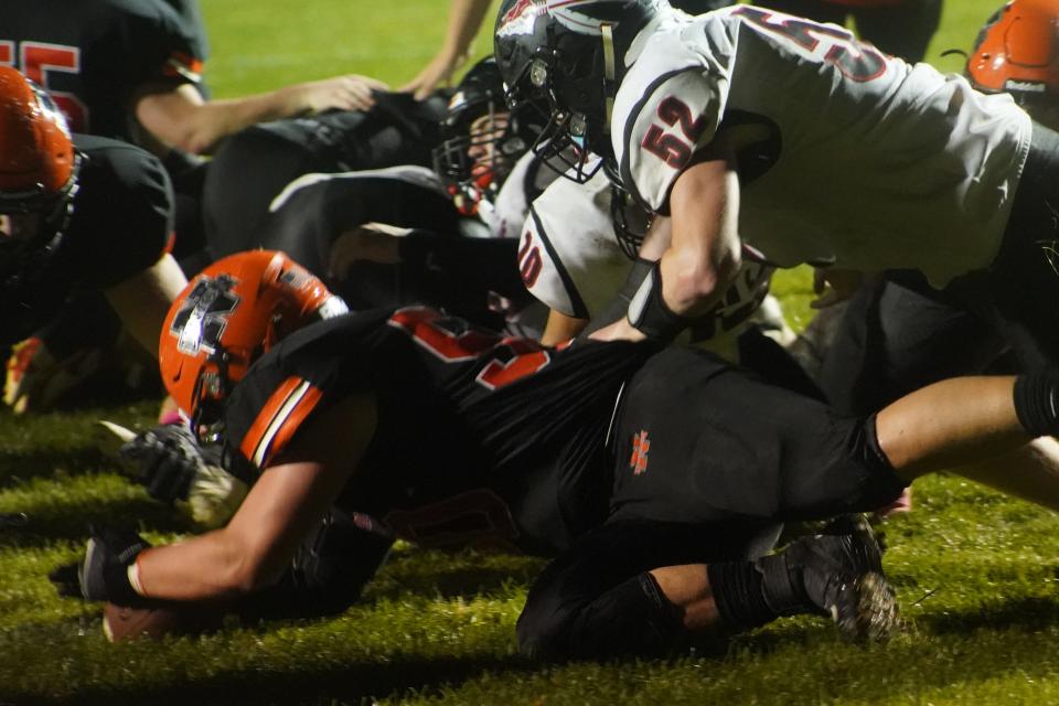 North Union jumps on a fumble during a football game with Indian Lake last season.