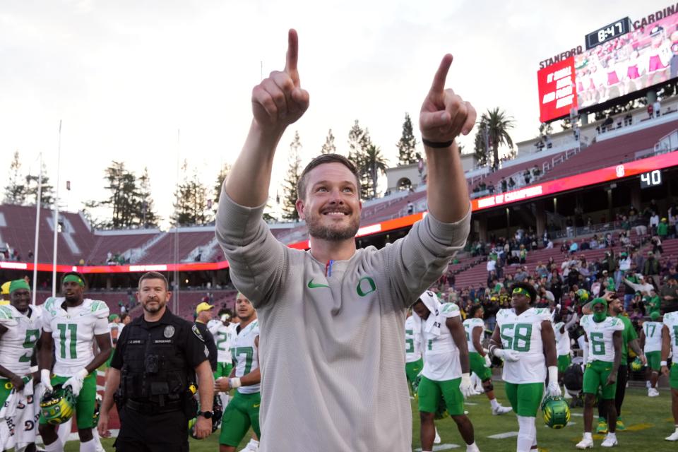 Oregon Ducks head coach Dan Lanning celebrates after defeating the Stanford Cardinal at Stanford Stadium.