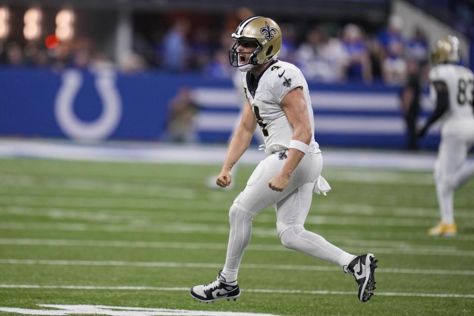 New Orleans Saints quarterback Derek Carr celebrates a first down.