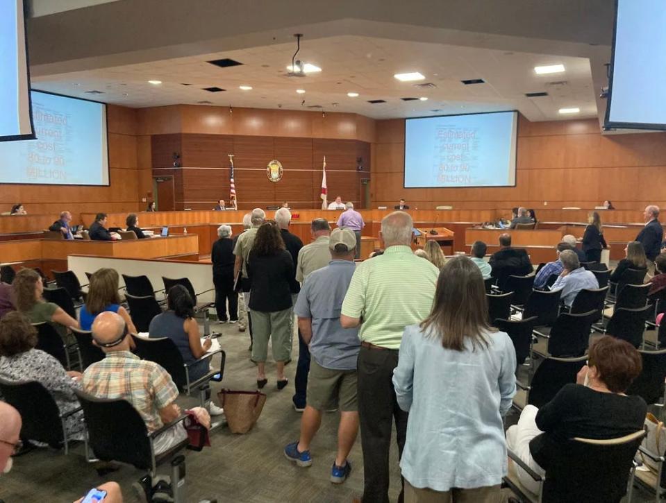 St. Johns County residents line up to speak at a St. Johns County Commission meeting in 2021 regarding developer Hutson Companies' plans to expand its SilverLeaf master-planned community by an additional 5,600 homes. The commission approved the expansion by a 4-to-1 vote.