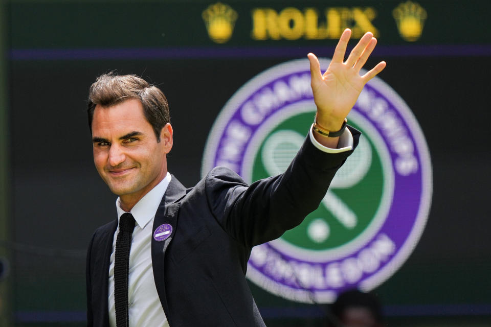 Roger Federer, pictured here waving to fans at Wimbledon during a ceremony on centre court.