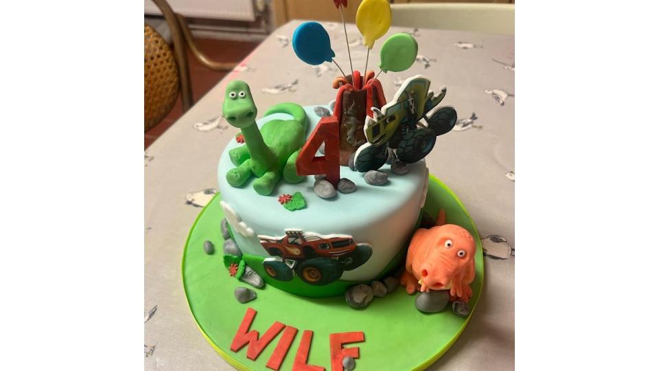 Child's birthday cake with dinosaurs