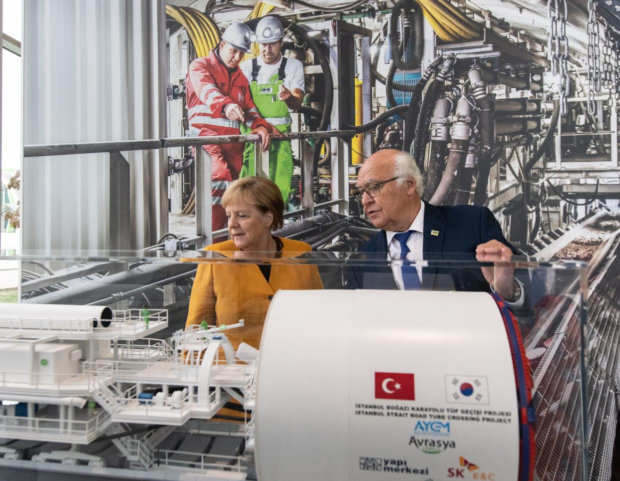 German Chancellor Angela Merkel stands next to company founder and CEO Martin Herrenknecht as she visits the Herrenknecht company producing tunnel boring machines and developing project-specific tunnelling technologies plant in Schwanau, southern Germany, on October 7, 2019. (Photo by Patrick Seeger / dpa / AFP) / Germany OUT (Photo by PATRICK SEEGER/dpa/AFP via Getty Images)