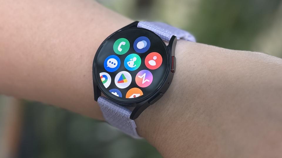 Samsung Galaxy Watch 6 on a person's wrist showing the apps list