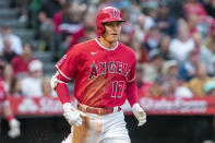 Los Angeles Angels' Shohei Ohtani heads toward first on a groundout to Oakland Athletics first baseman Seth Brown during the third inning of a baseball game in Anaheim, Calif., Friday, May 20, 2022. (AP Photo/Alex Gallardo)