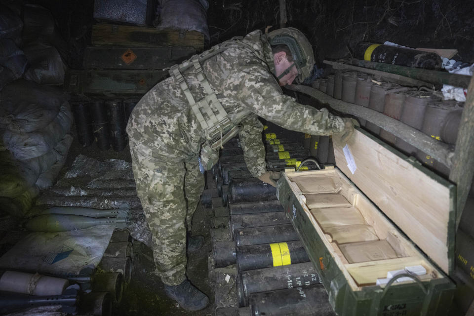FILE - A Ukrainian serviceman of the 28th Separate Mechanised Brigade checks ammunitions in a trench at the front line, near Bakhmut, Donetsk region, Ukraine, Sunday, March 3, 2024. (AP Photo/Efrem Lukatsky, File)