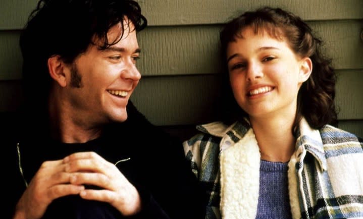 A man and a child smile in Beautiful Girls.