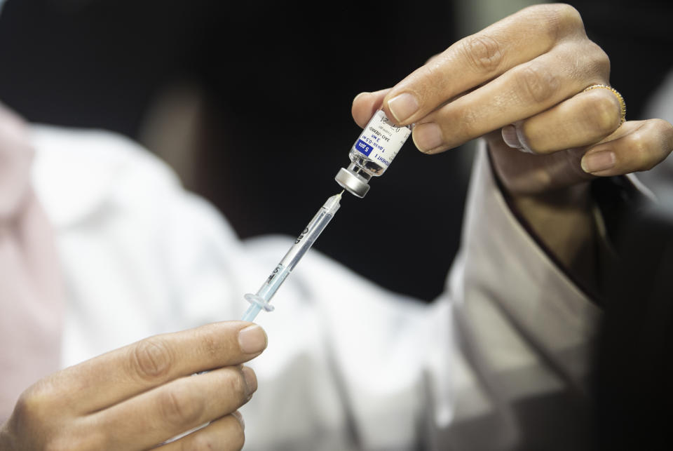 A Palestinian medic prepares a shot of the Russian-made Sputnik V coronavirus vaccine, in Gaza City, Monday, Feb. 22, 2021. (AP Photo/Khalil Hamra)