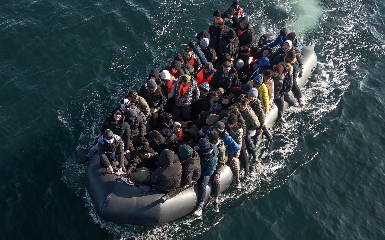 An inflatable dinghy carrying around 65 migrants crosses the English Channel on March 06, 2024 in the English Channel