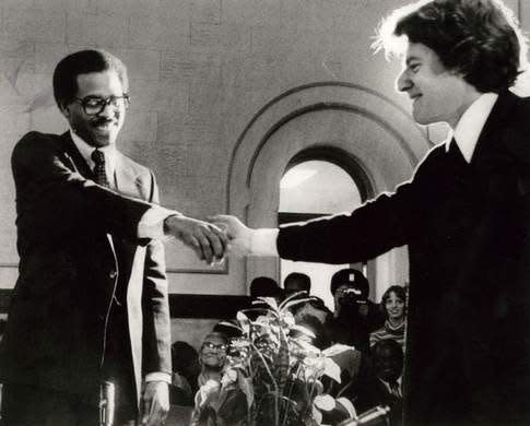 Cincinnati Mayor Jerry Springer, right, shakes hands with Vice Mayor Ken Blackwell in December 1977.