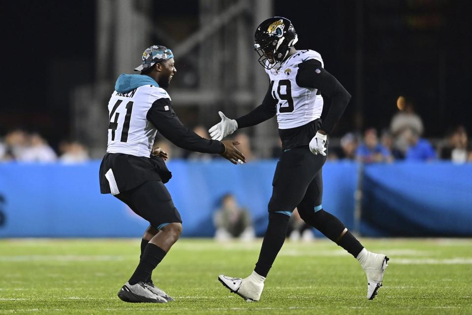 Jaguars defensive end Arden Key (49) is congratulated by teammate Josh Allen (41) after one of his two sacks last week in the team's first preseason game against the Las Vegas Raiders, in Canton, Ohio.